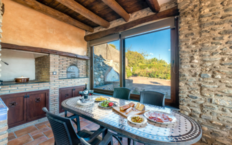 Outdoors dining area with wood oven